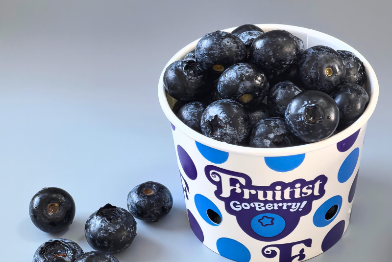 a friut paper bowl, berry inside